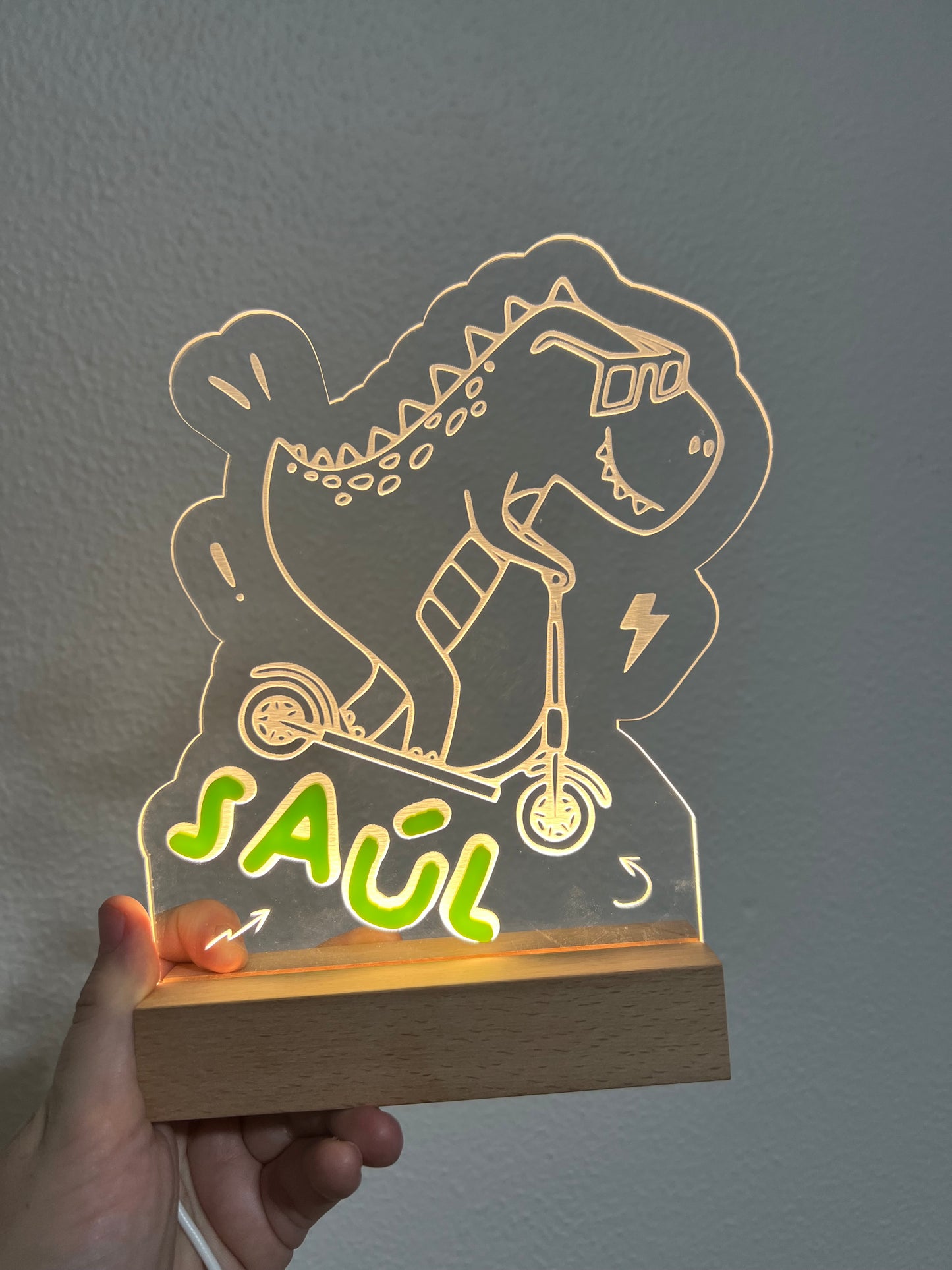 Lámpara dinosaurio patinete